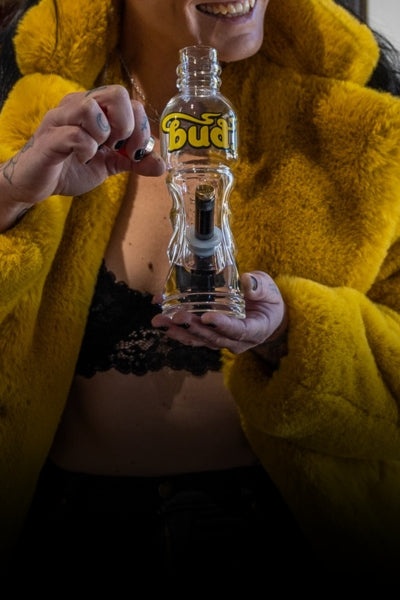 Woman holding Bud Bottle Bong