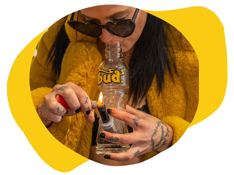 Woman smoking from the Bud Bottle Bong 23cm